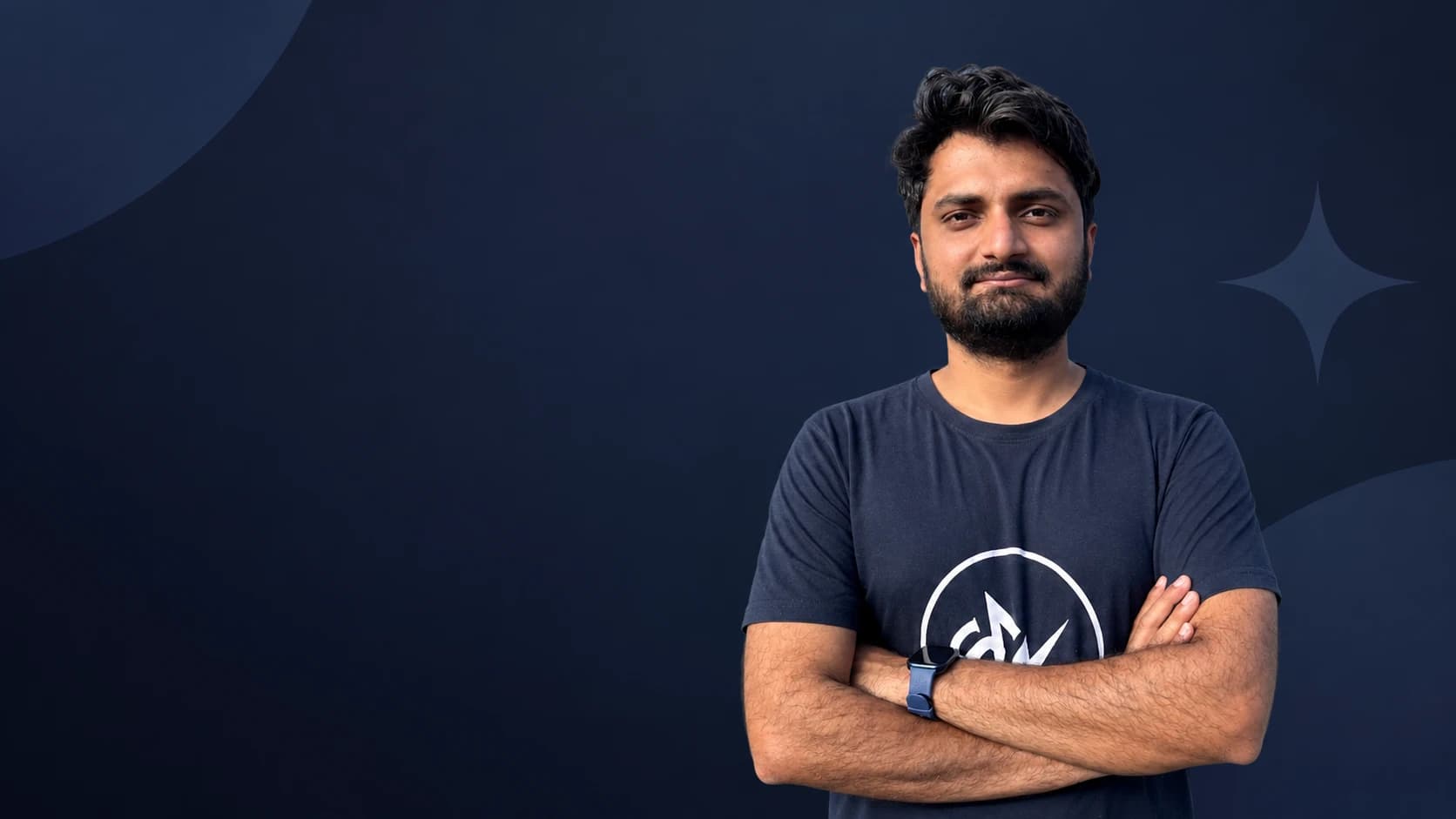 Spark AI's founder, standing with his arms folded
